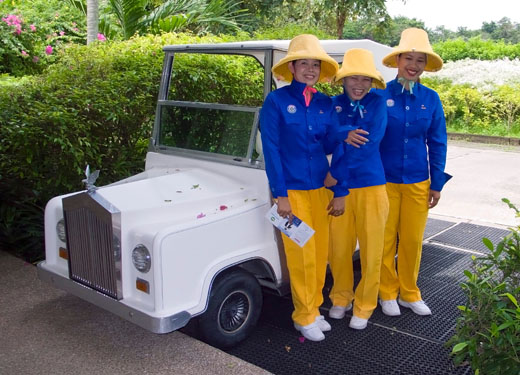 Navatanee's caddies and the club's "Rolls Royce" golf cart