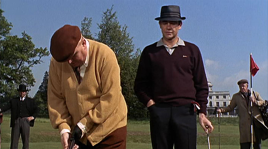 007 watches Goldfinger putt during the 1964 Bond film: Ian Fleming, the book's author based the ficticious Royal St. Mark's course on his home club at Sandwich