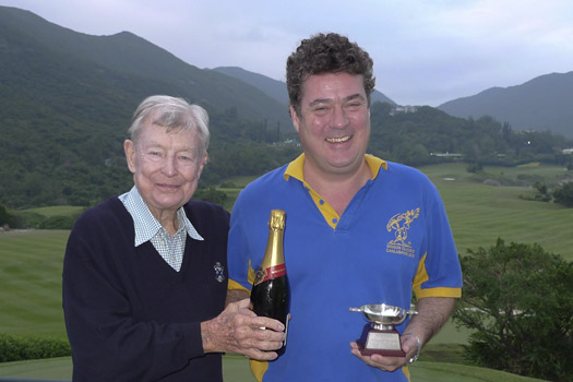 Jock Mackie presents the quaich to winner Graeme Brechin