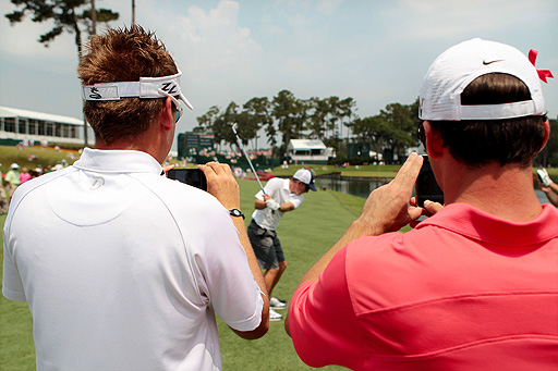 Ian Poulter (left) acts as camera-man