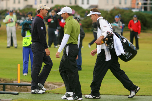 Padraig Harrington walks past Sergio Garcia