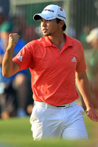 Jason Day celebrates hitting a good shot