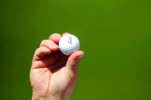 Eagle Ball: A fan holds up Louis Oosthuizens' double eagle golf ball