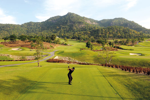 A golfer tees off at the nearby Black Mountain Golf Club