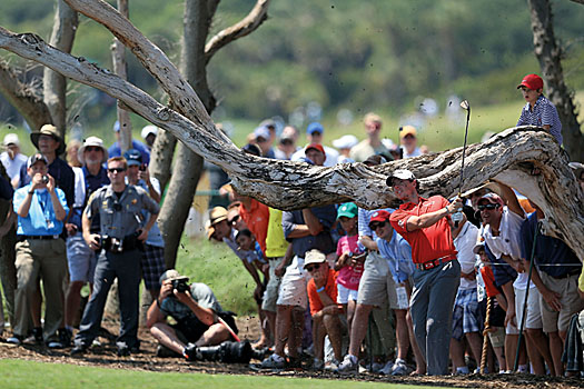 McIlroy made a great up-and-down from wood chips at the 2nd hole