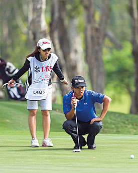 Steven Lam and his caddie Tiffany Chan