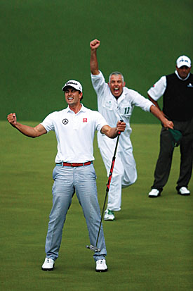 Scott and caddie Steve Williams celebrate