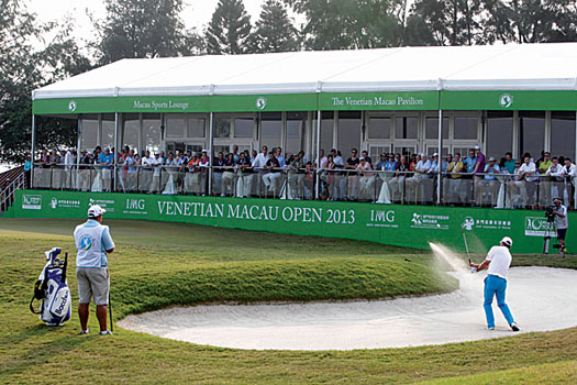 Scott Hend hits his third shot at the 18th during the third round to set up a birdie