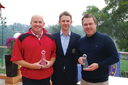 Orgill and McDonald receive their trophies from HKGA Chief Executive Tom Phillips
