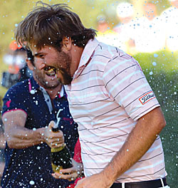 Dubuisson is showered in champagne
