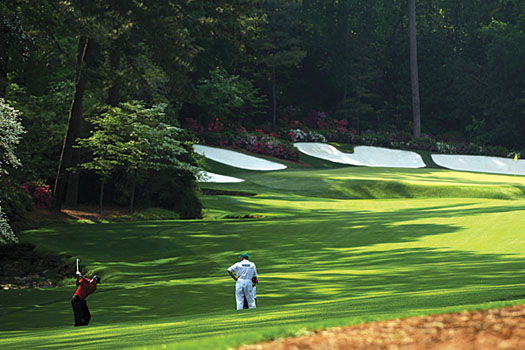 Tiger Woods plays his second shot to the par-5 13th, the final hole of Amen Corner
