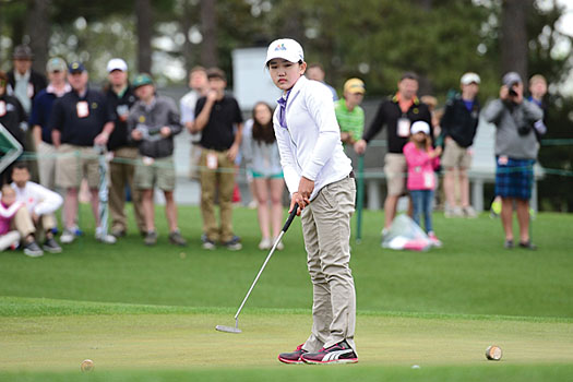 The 11-year-old eyes a putt on Augusta’s 18th green