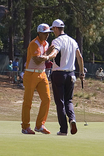 Kaymer with a friendly pat for Fowler