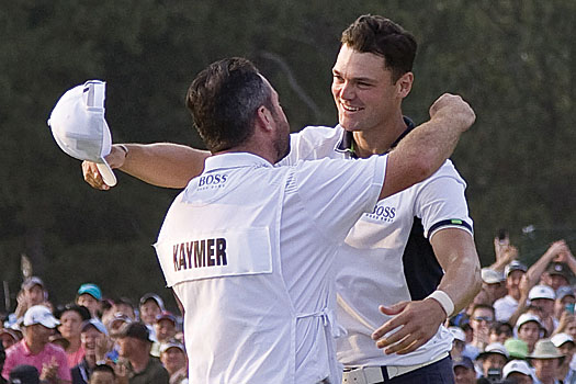 Kaymer celebrates with his caddie, Scotsman Craig Connelly