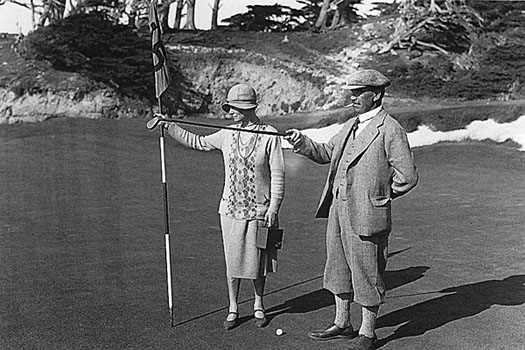 At his home course of Pasatiempo with his wife