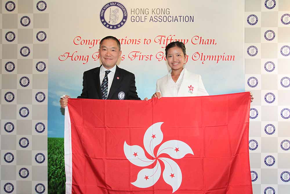 Being presented with the flag of Hong Kong from Mark Chan