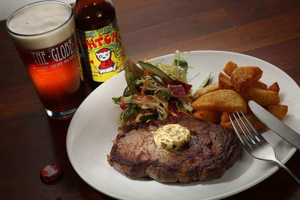 Voted one of the top 21 best beer bars in the world, The Globe is featuring this amazing 10oz Ashdale Farm Rib Eye with Tiny Rebel Cwtch
