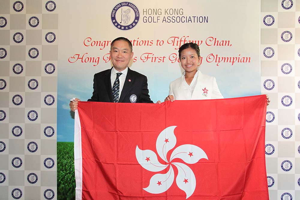 Mark Chan presented Tiffany Chan with a commemorative flag of Hong Kong