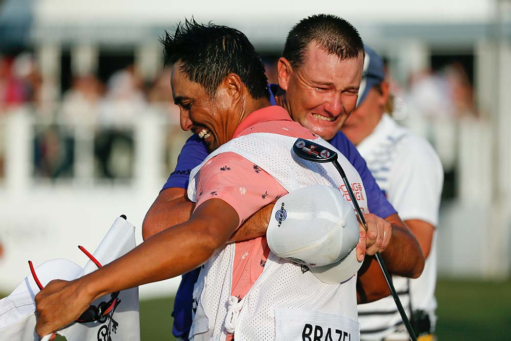 An emotional Brazel celebrates with his caddie