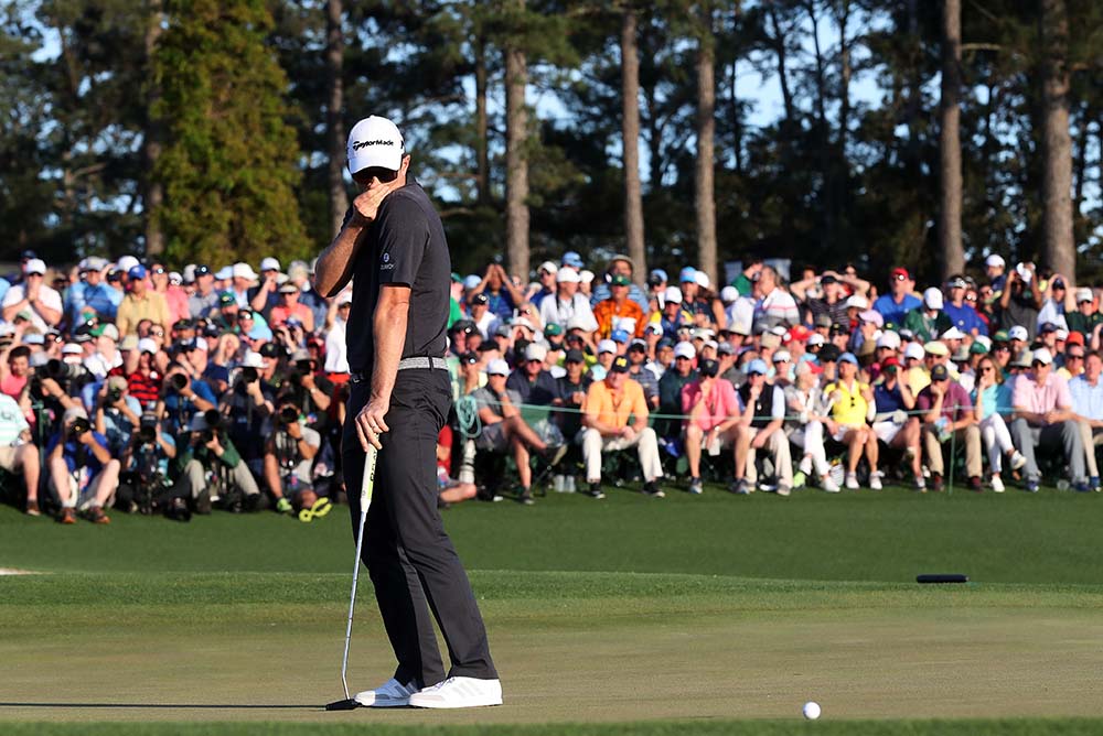 Justin Rose reacts to his missed birdie putt on the 18th hole during the final round of the 2017 Masters