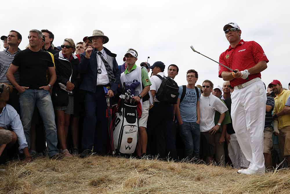 Lee Westwood watches his shot played out of the rough during the 2013 Open