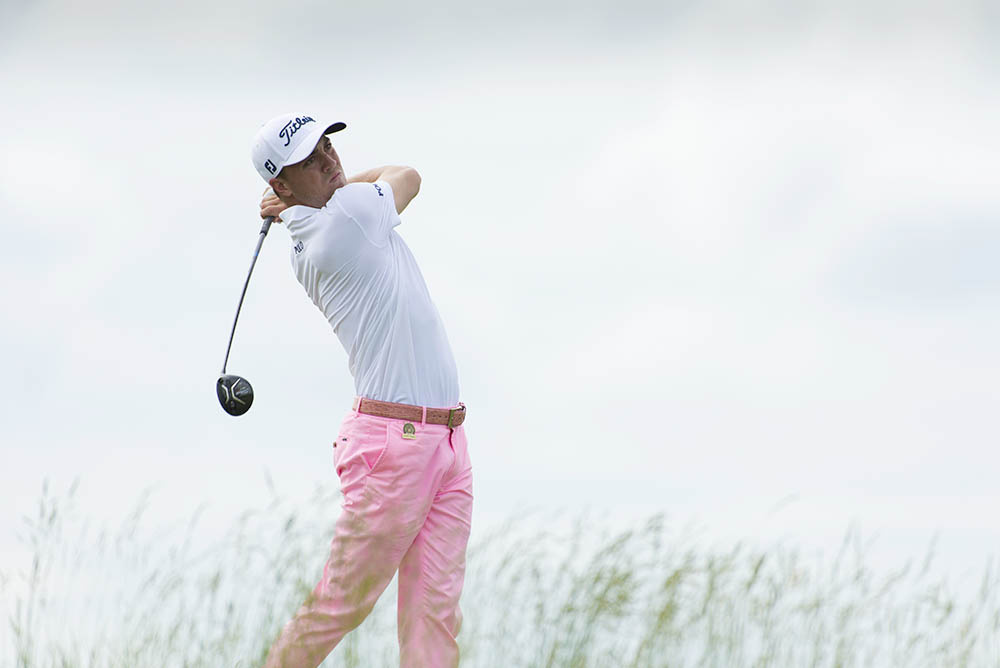 Justin Thomas hits his tee shot on the 18th hole during the third round