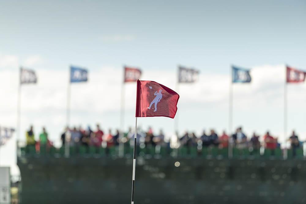 A view of the flag on the 18th featuring Arnold Palmer at Erin Hills