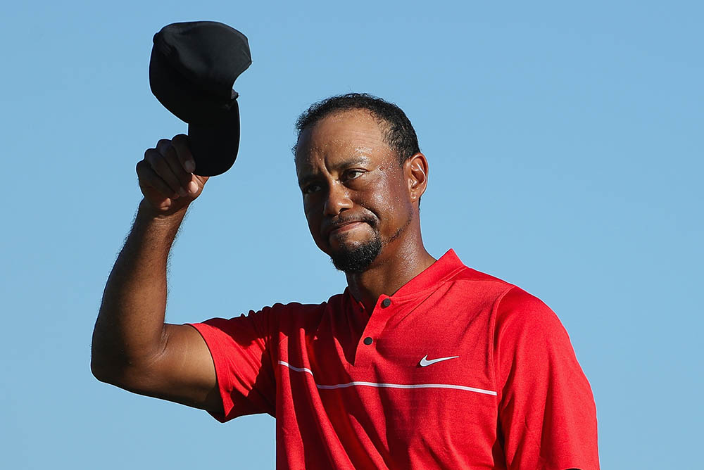 Tiger Woods tips his cap during the final round of the Hero World Challenge