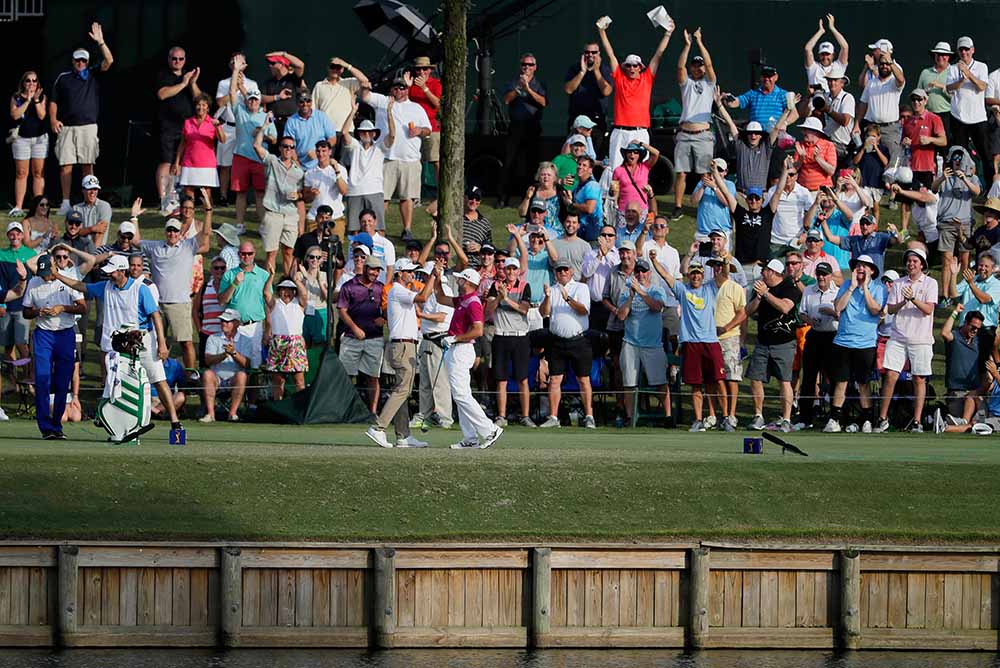Sergio Garcia celebrates his hole in one on the 17th with Adam Scott during the first round of THE PLAYERS Championship at the Stadium Course at TPC Sawgrass