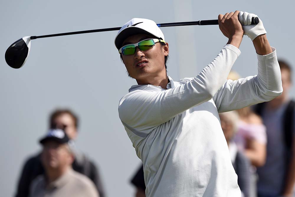 Li Hao-tong watches his drive during the 146th Open Championship