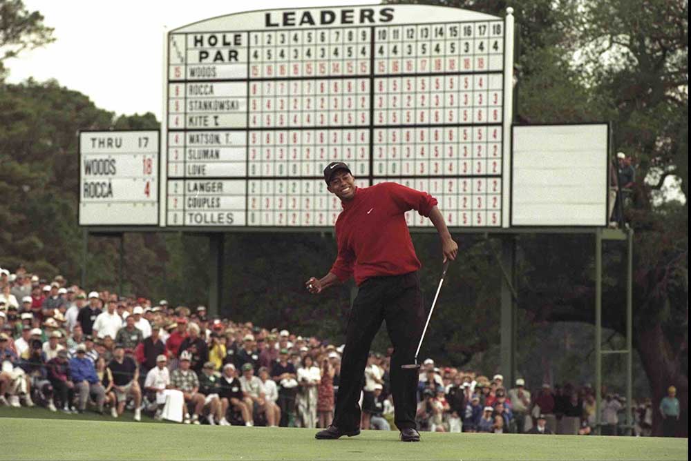 Tiger Woods celebrates after winning his maiden Major at the 1997 Masters