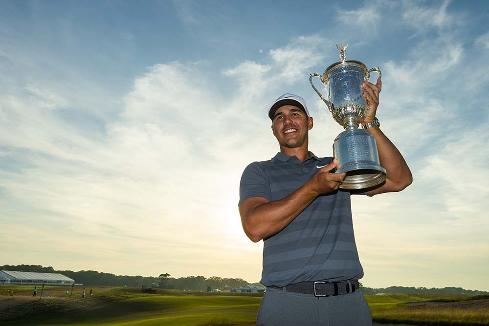 Brooks Koepka poses with the trophy after winning the 2018 U.S. Open