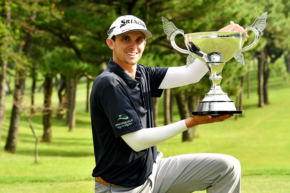 John Catlin holding the winner’s trophy at the Yeangder TPC