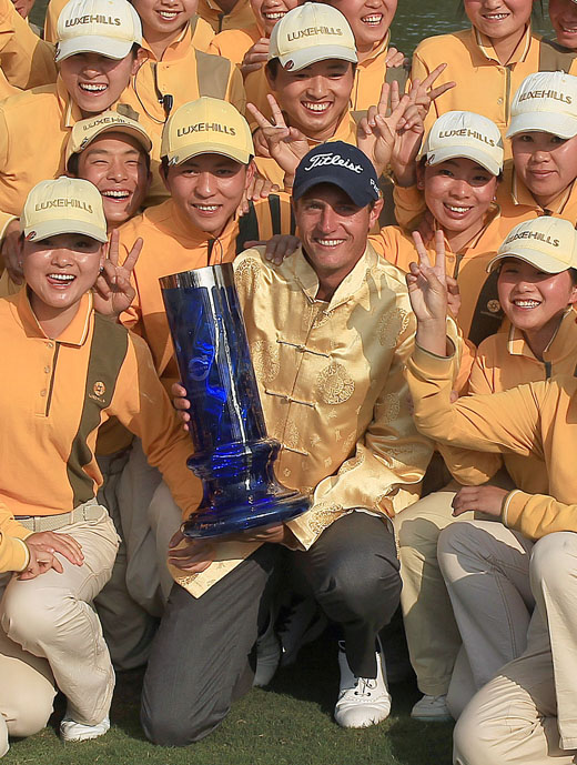 Nicolas Colsaerts with the  trophy and caddies at the Volvo China Open