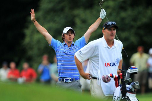 McIlroy raises his hands in celebration of his 8th hole eagle