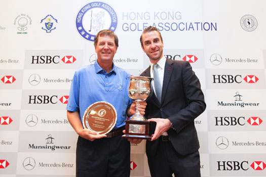 Doug Williams of Hong Kong receives the 2015 Hong Kong Seniors Open Amateur Championship trophy from Peter Larko, Head of Marketing Communications and PR for Mercedes-Benz Hong Kong
